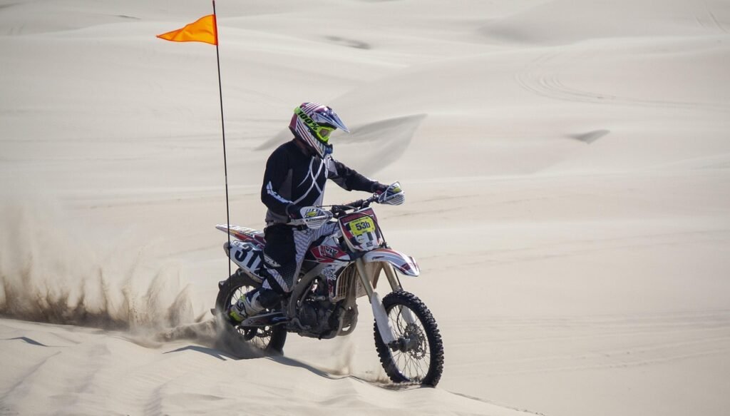 Biker Keeping Going in the Desert Heat